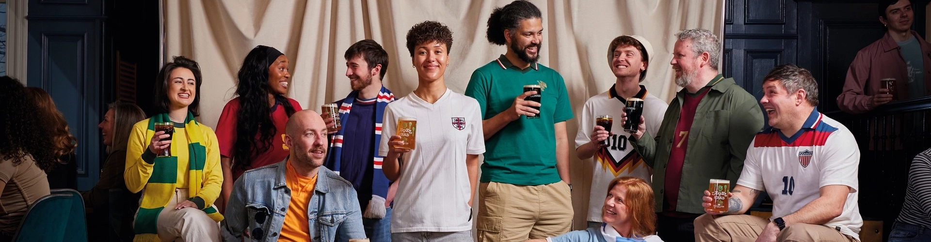 Football supporters socialising together in a pub